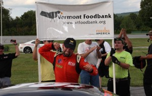 Travis Stearns of Auburn, ME celebrates his first career ACT win in the VT Foodbank Labor Day Classic 200 at Thunder Road. (Photo by Alan Ward).